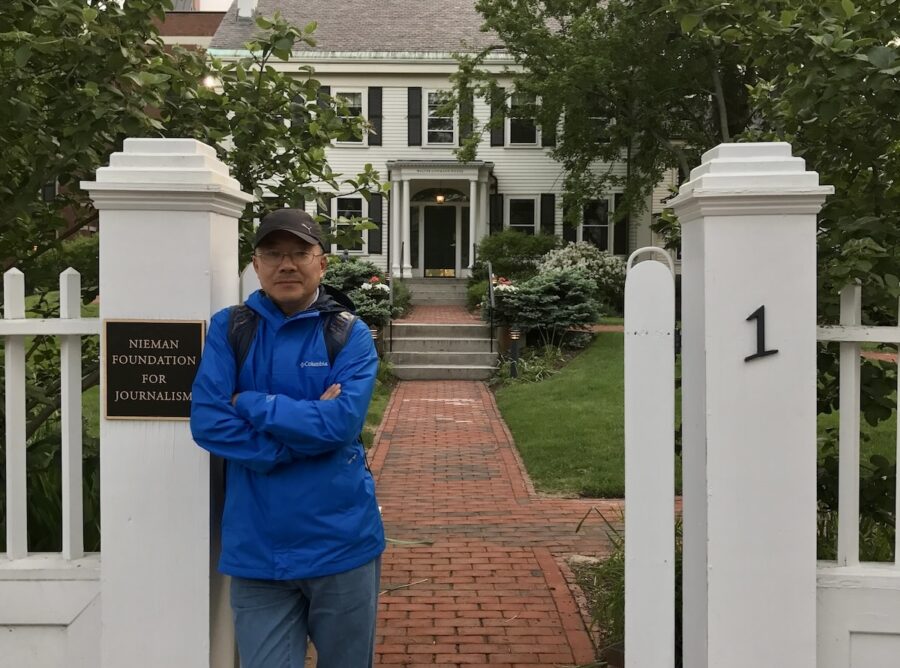 2007 Nieman Fellow Dong Yuyu stands in front of the Nieman Foundation for Journalism at Harvard University
