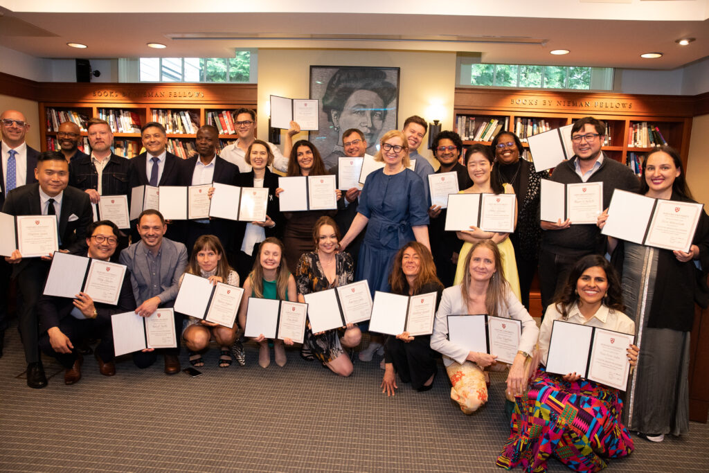 Fellows in the Class of 2025 celebrate with Nieman Curator Ann Marie Lipinski after receiving their certificates on May 19, 2025. Photo byLisa Abitbol
