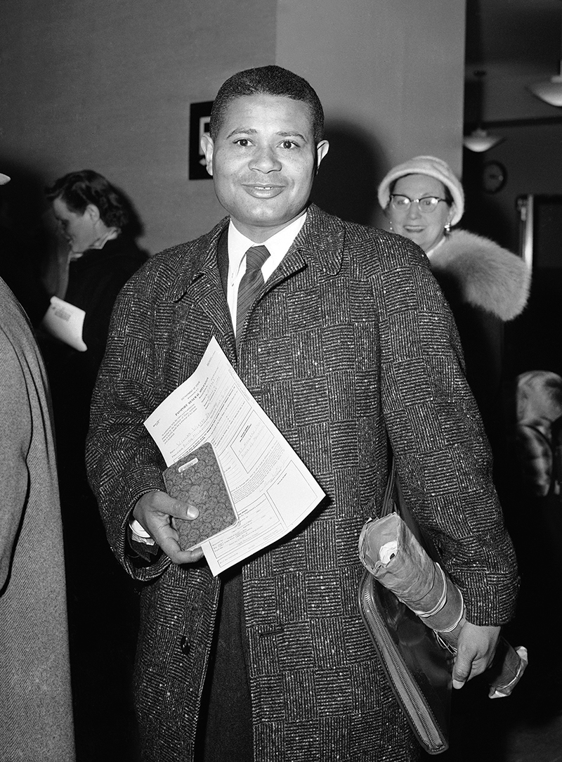 William Worthy at the U.S. Passport Agency in 1957. His renewal was denied after he visited China, leading to the first of several legal battles he had with government during his lifetime. Photo by Jacob Harris/Associated Press