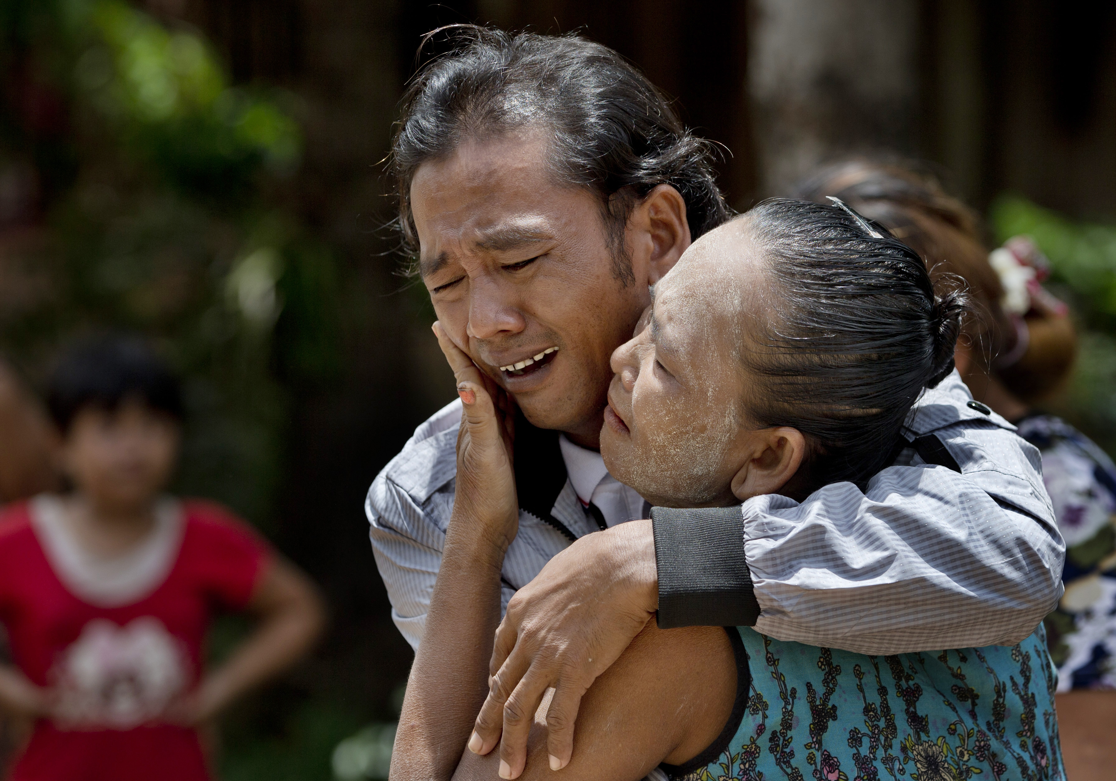 Former slave fisherman embraces his mother after returning to Myanmar