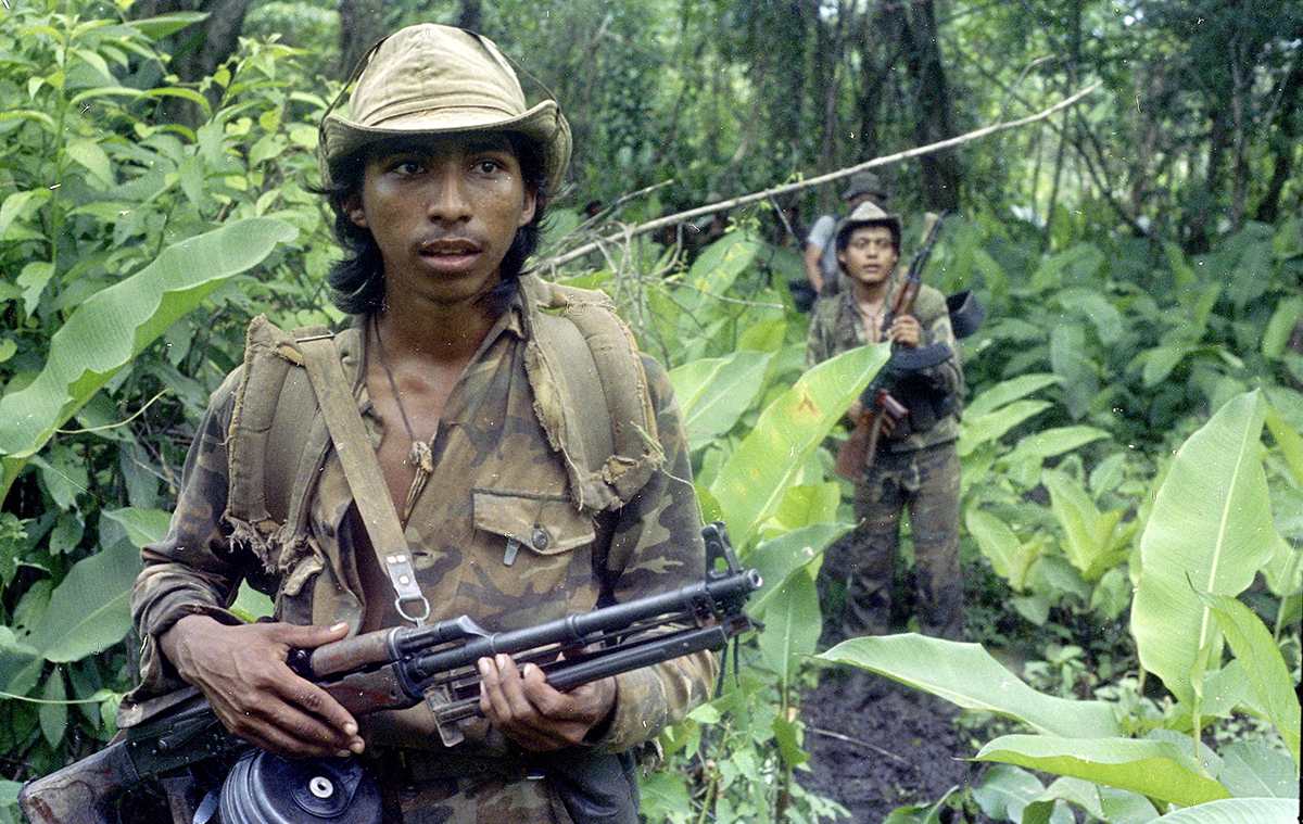 A Sandinista soldier looks for U.S.-backed contra rebels in Nicaragua