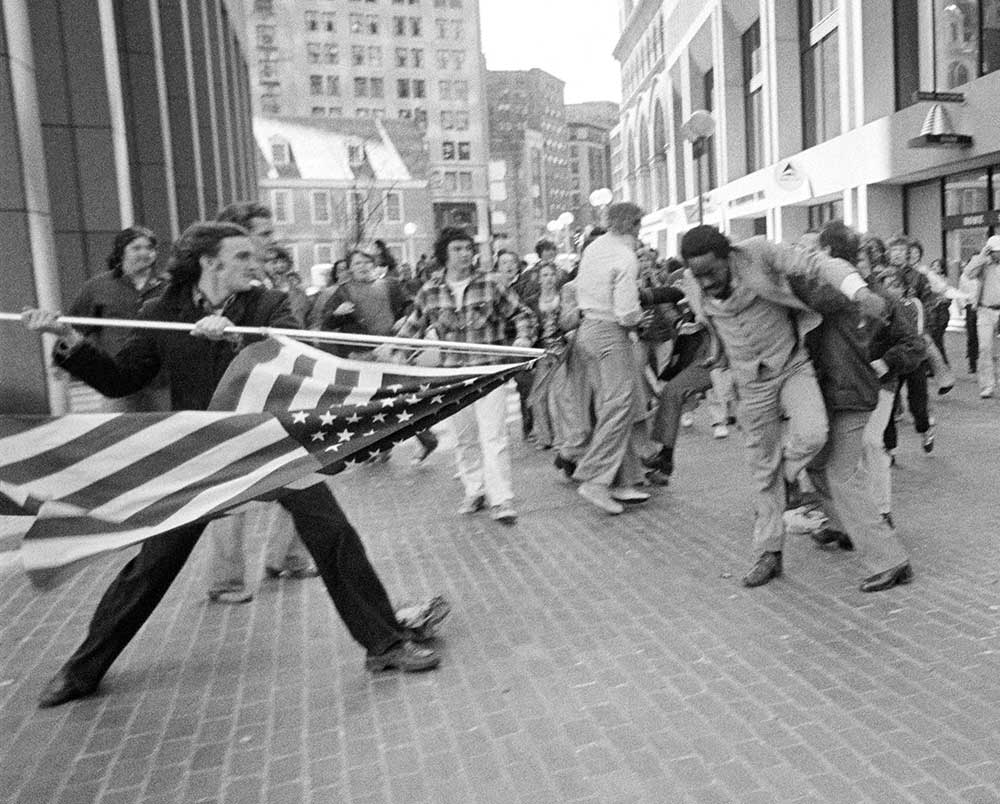 Demonstrators near Boston City Hall in 1976 protest court-ordered school busing 