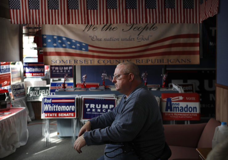 John Grooms of Madison, Maine, ponders the upcoming election at the Republican party headquarters in Skowhegan, Maine in October