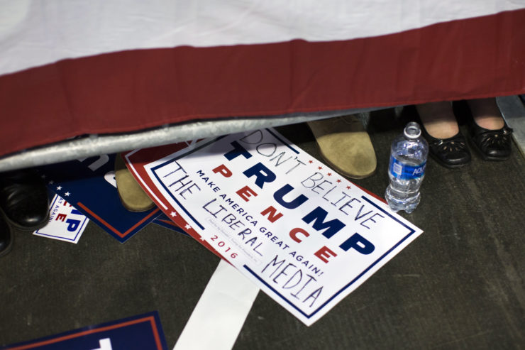 A sign for Republican presidential candidate Donald Trump lays on the floor during a campaign rally on Nov. 4 in Hershey, Pa.