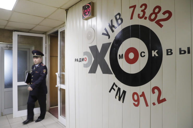 An Interior Ministry officer walks inside the office of Ekho Moskvy after an intruder attacked the station's deputy editor Tatyana Felgengauer in  October