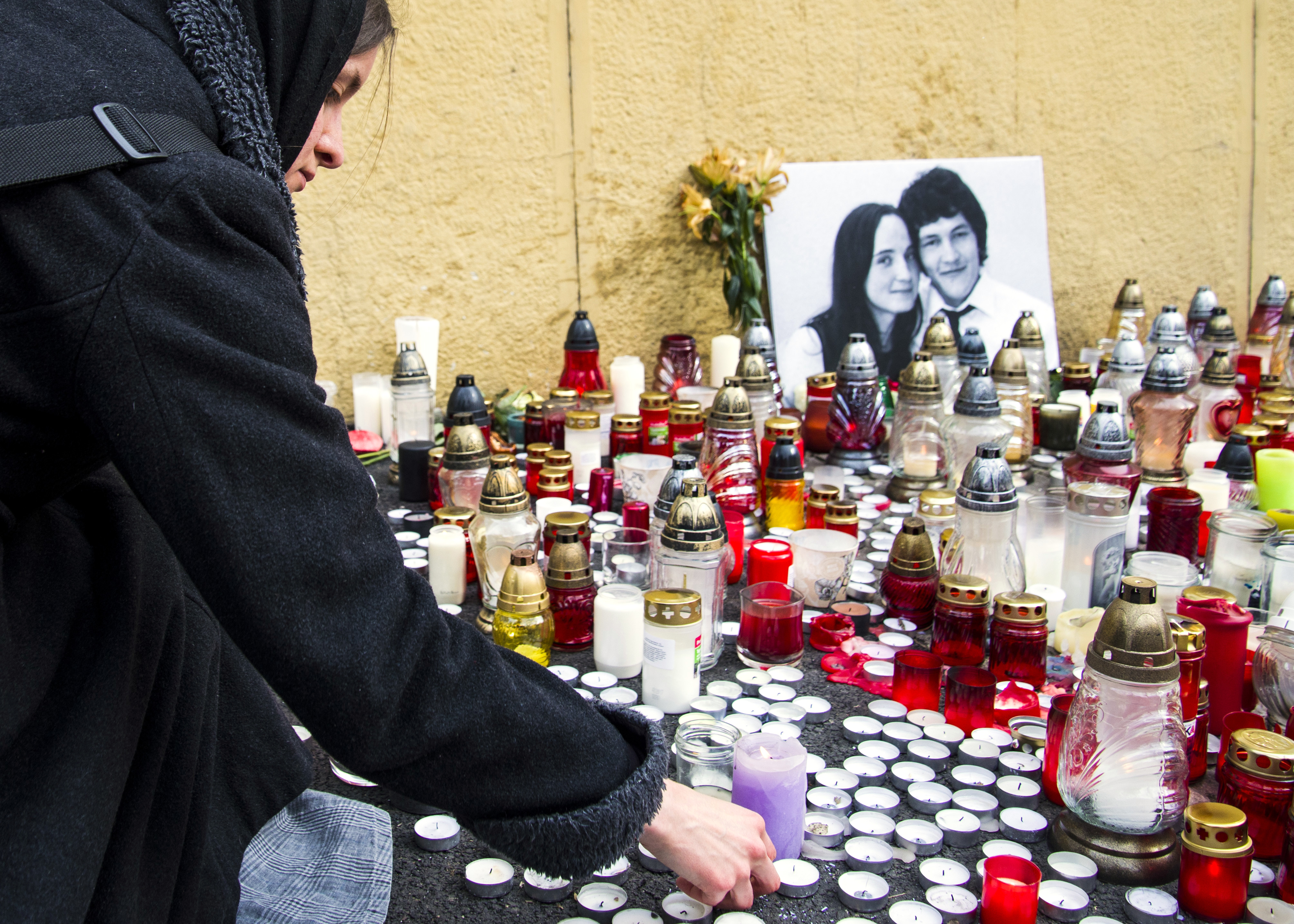 People light candles in tribute to murdered Slovakian investigative reporter Jan Kuciak and his fiancée, at Slovak National Uprising Square in Bratislava. Kuciak’s murder underlined the importance of independent news startups like Denník N