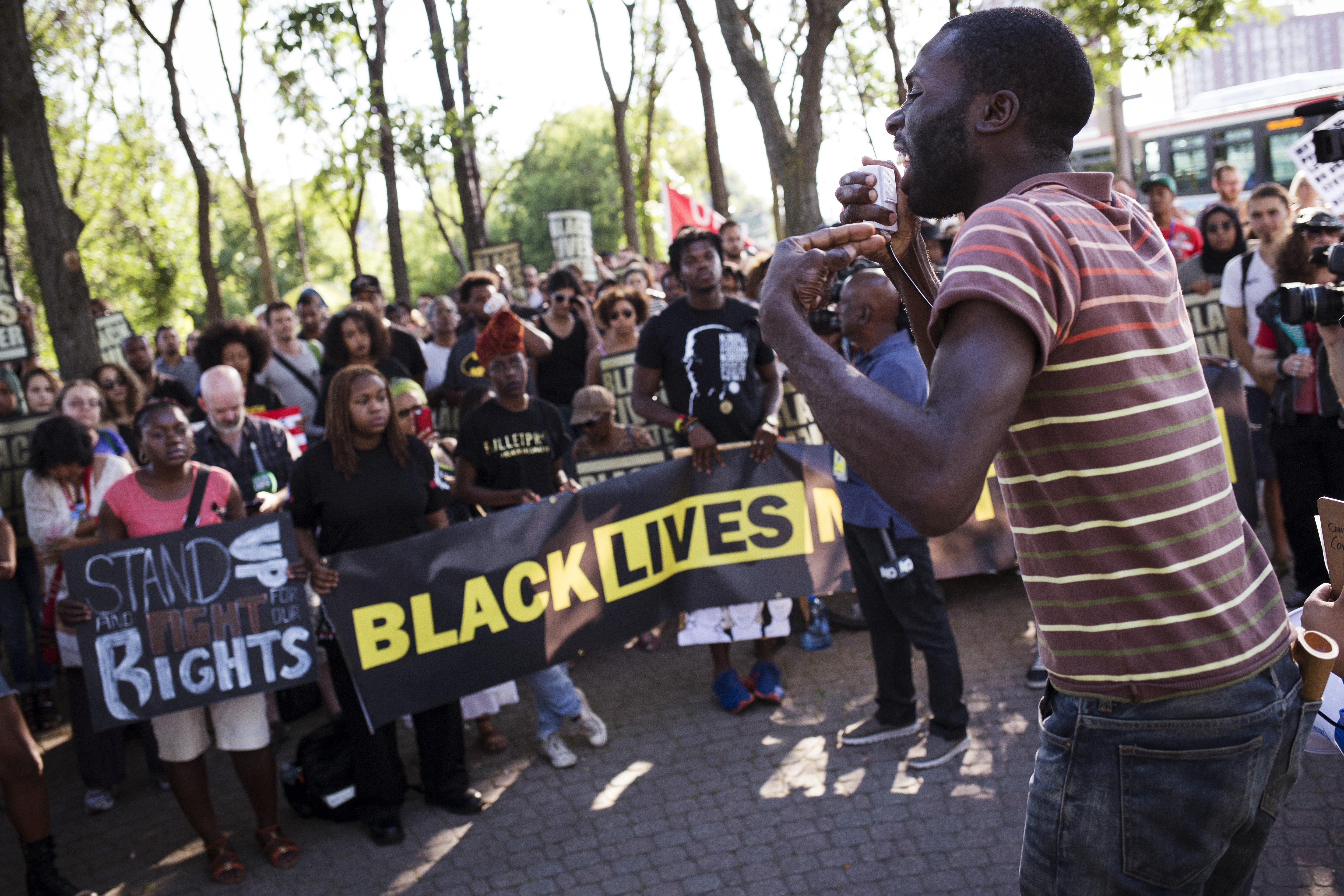 Former Toronto Star columnist Desmond Cole addresses the crowd at a Black Lives Matter protest in Toronto in July 2015. Cole left the paper in 2017, writing on his blog that “[i]f I must choose between a newspaper column and the actions I must take to liberate myself and my community, I choose activism in the service of Black liberation”