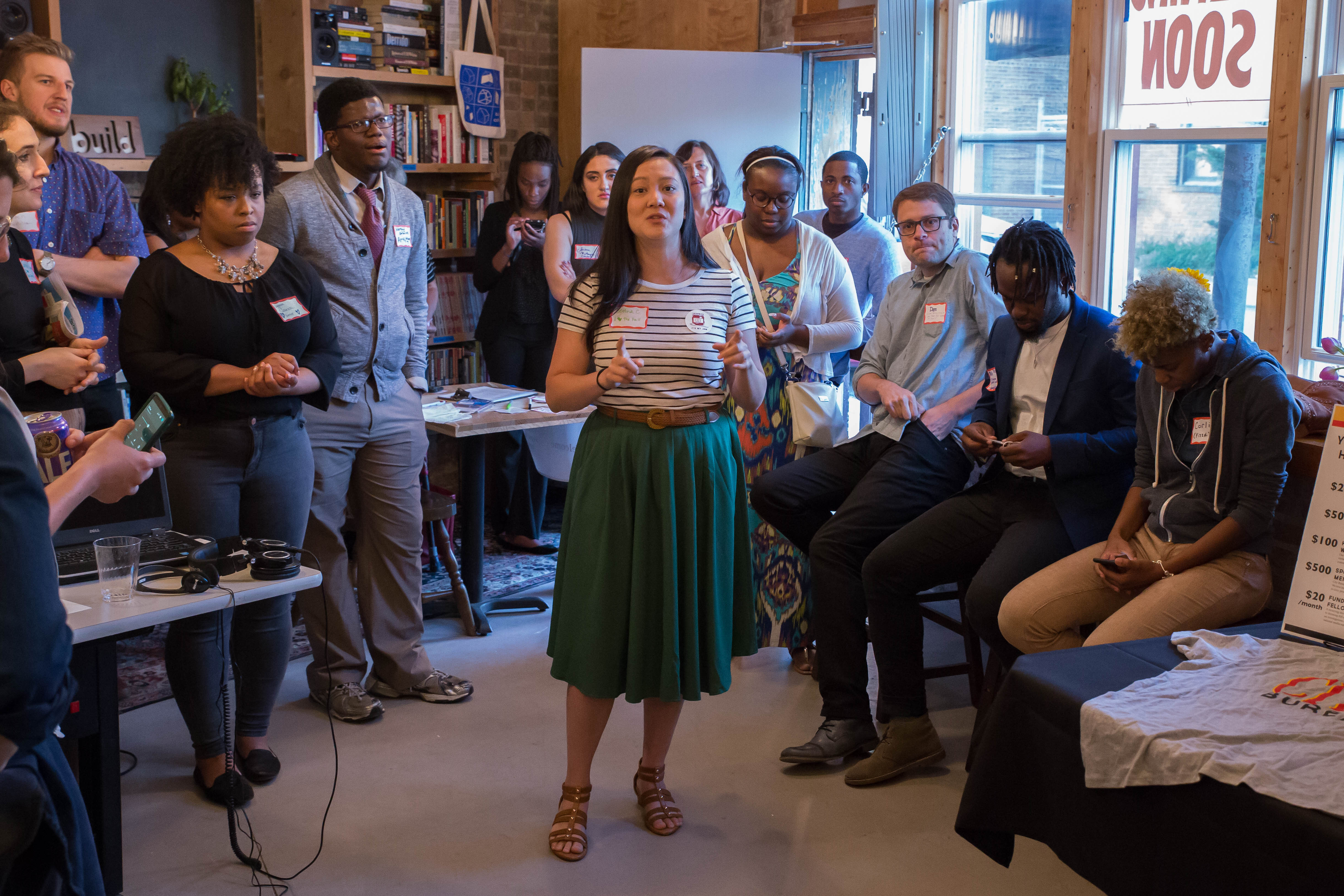 Bettina Chang, co-founder and editorial director of City Bureau, leads an event where City Bureau's reporters presented their work to community members