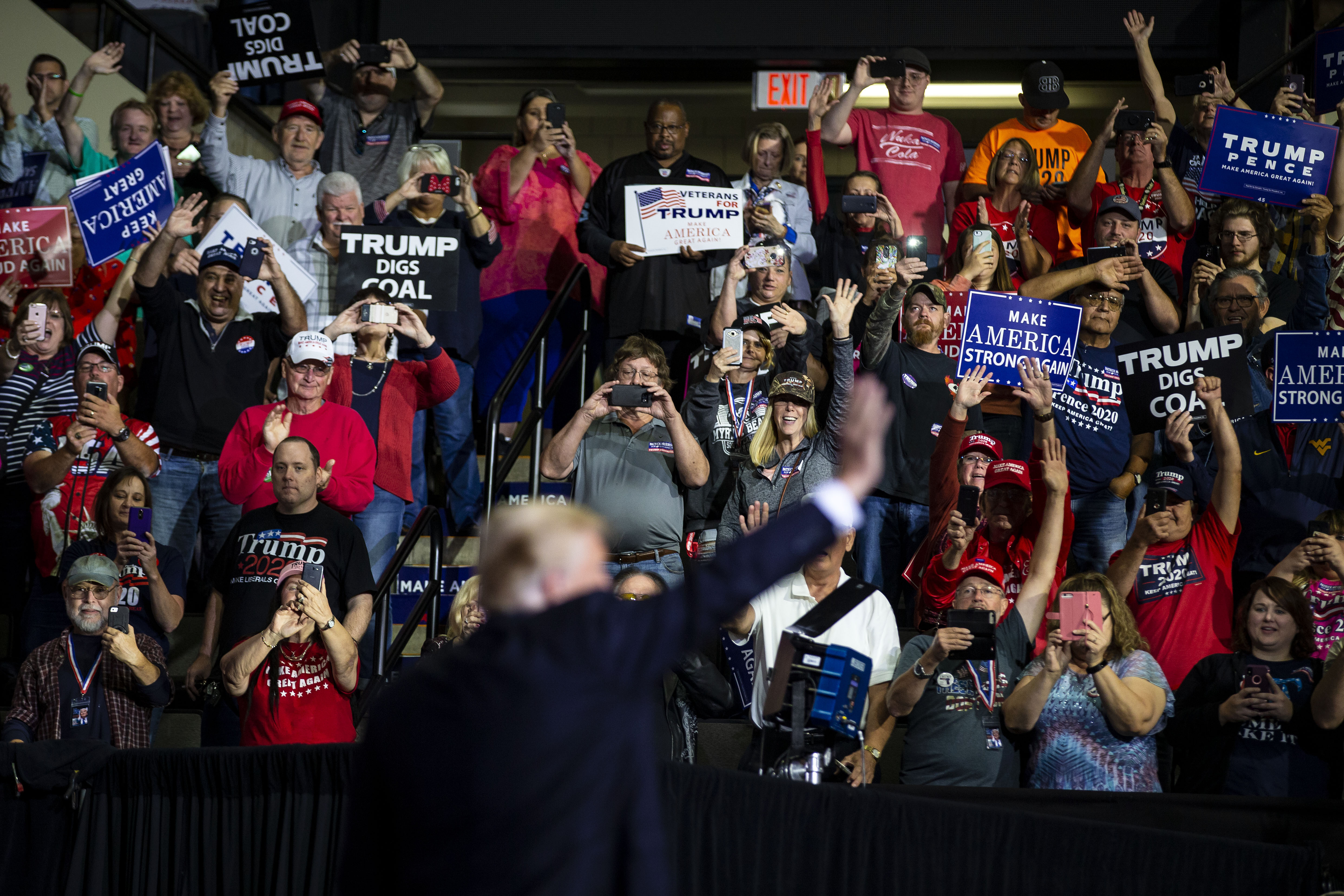 A crowd cheers as President Donald Trump arrives to speak during a rally at Wesbanco Arena, in Wheeling, W.Va. in September 2018. At NPR, Asma Khalid met with over 50 Republican voters across Ohio, Georgia, and West Virginia in order to assess the strength of the electoral coalition that had helped Trump to win in 2016