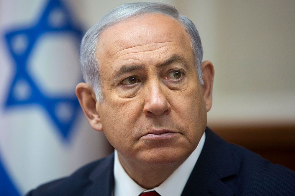 Israeli Prime Minister Benjamin Netanyahu attends a weekly cabinet meeting at the prime minister's office in Jerusalem in 2018. Netanyahu, who is up for re-election in April, may face charges of bribery, fraud, and breach of trust