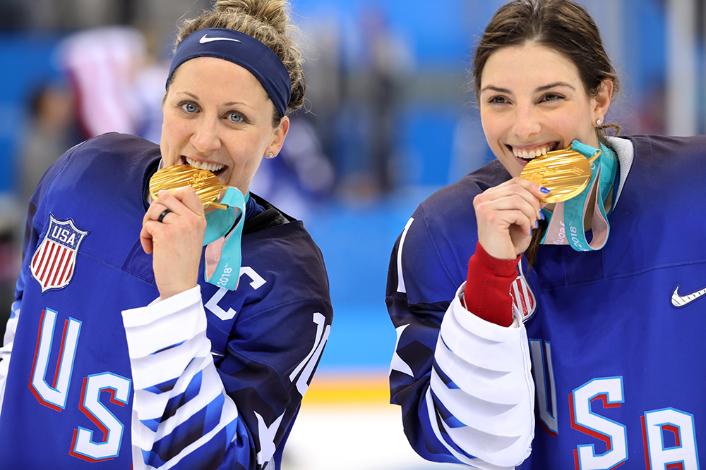 Meghan Duggan (left) celebrates with Team USA teammate Hilary Knight after beating Canada to win gold at the 2018 Pyeongchang Winter Olympic Games