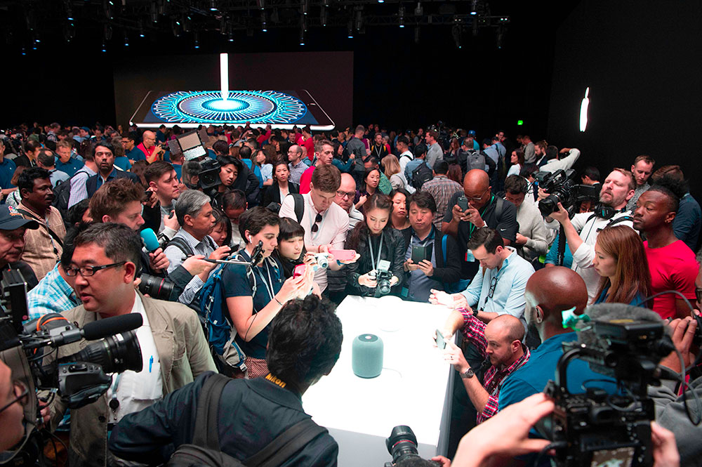A new Apple HomePod smart speaker is surrounded by members of the media during Apple's Worldwide Developers Conference in San Jose, California in June 2017