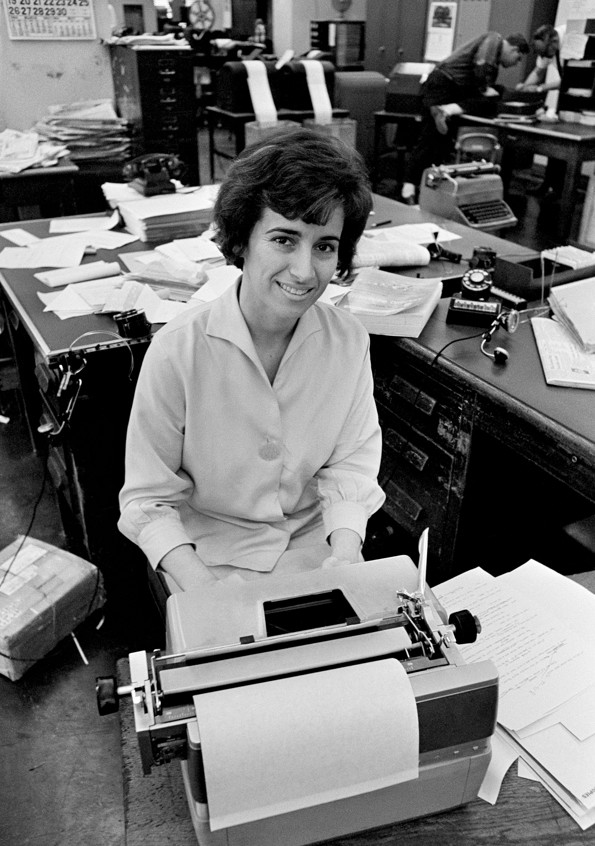 Associated Press journalist Kathryn Johnson sits at her desk in Atlanta in 1964