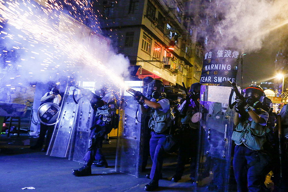 Police fire tear gas at anti-extradition bill protesters during clashes in Sham Shui Po in Hong Kong, China in August