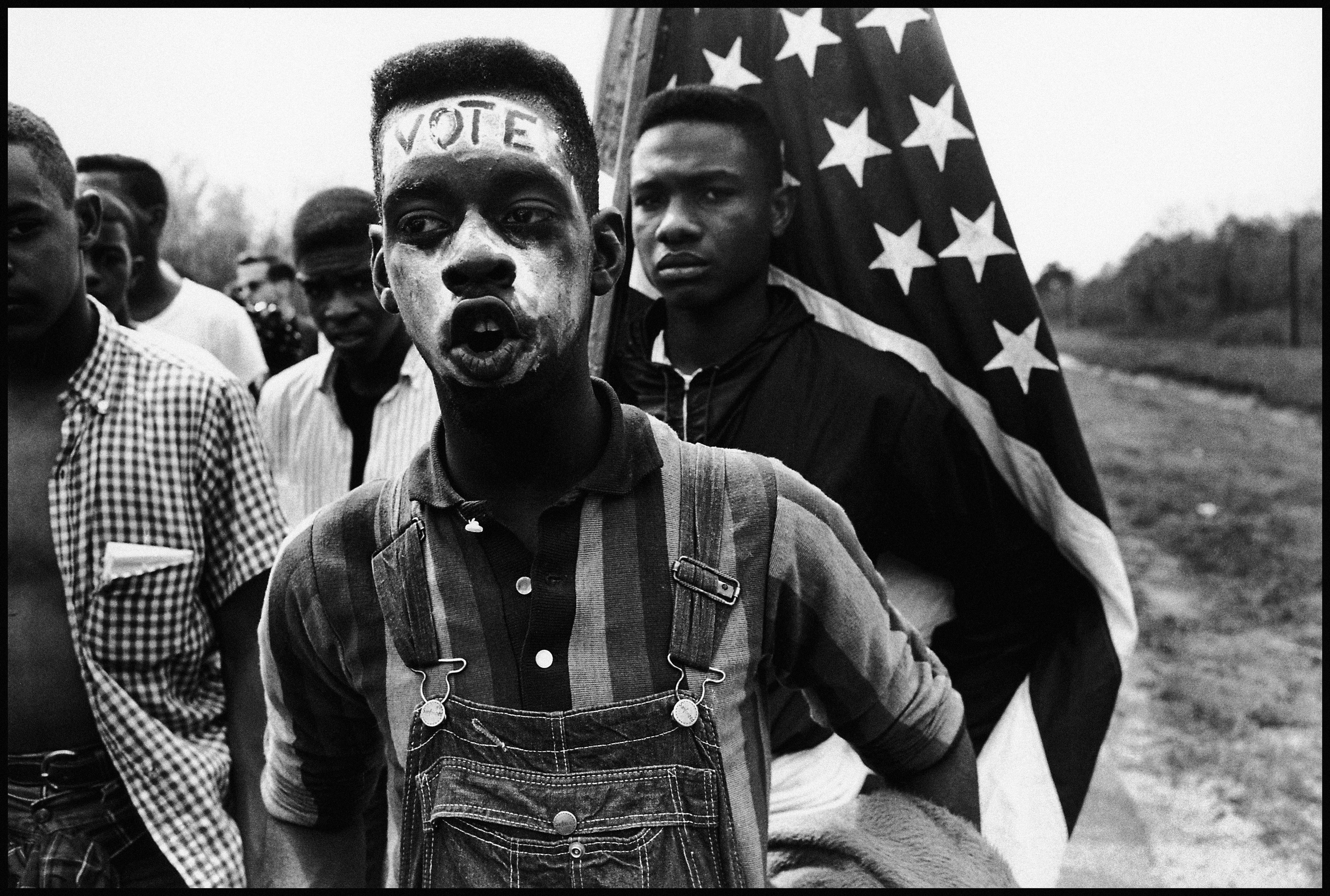 A civil rights demonstrator participates in the Selma to Mongtomery, Alabama march, led by Martin Luther King, Jr., in 1965.