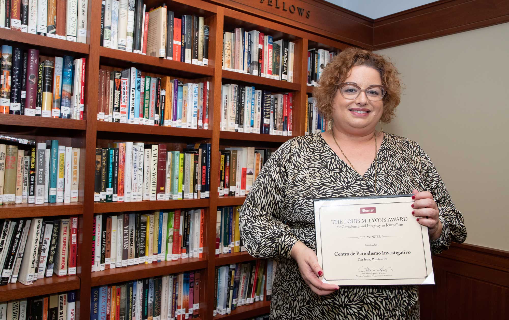 Centro de Periodismo Investigativo’s executive director Carla Minet holds the 2020 Louis M. Lyons Award for Conscience and Integrity in Journalism.