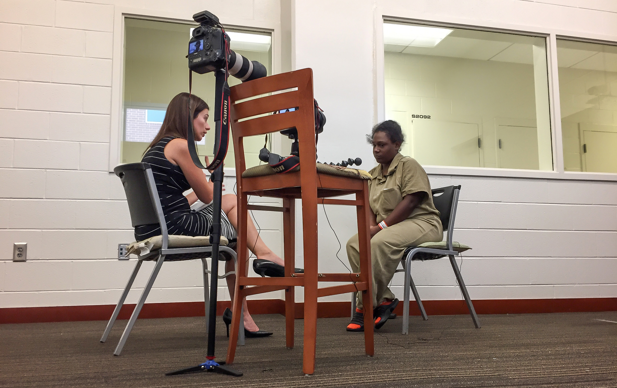 Reporter Marisa Kwiatkowski prepares to interview Ashley Peterson inside the Douglas County Jail