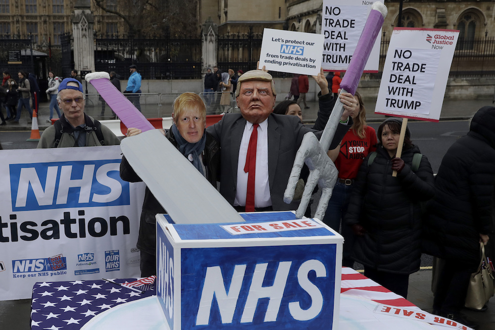 Protestors, including ones with masks of U.S. President Donald Trump and British Prime Minister Boris Johnson, call for the U.K.’s National Health Service (NHS) to be taken off the table in a trade deal with the U.S. in 2019. Britain’s Labour opposition party revealed the leaked documents detailing the U.K.-U.S. trade talks, but not their source