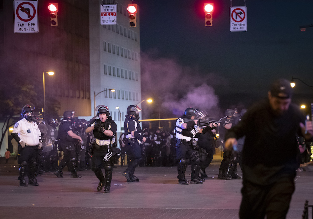 Police in Columbus, Ohio fire non-lethal projectiles — one of which hit photographer Adam Cairns — to disperse crowds during a downtown protest on May 31