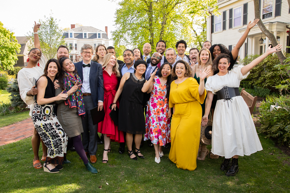 The Nieman class of 2022 celebrates the end of their fellowship year with Harvard President Lawrence Bacow on May 12, 2022.