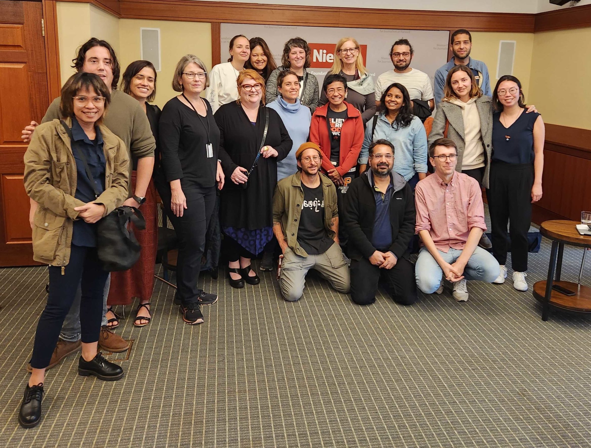 Maria Ressa (center, with orange jacket) and Dr. Julie Posetti (with shoulder bag) meet with the 2023 Nieman Fellows in Cambridge on Nov. 12, 2022.
