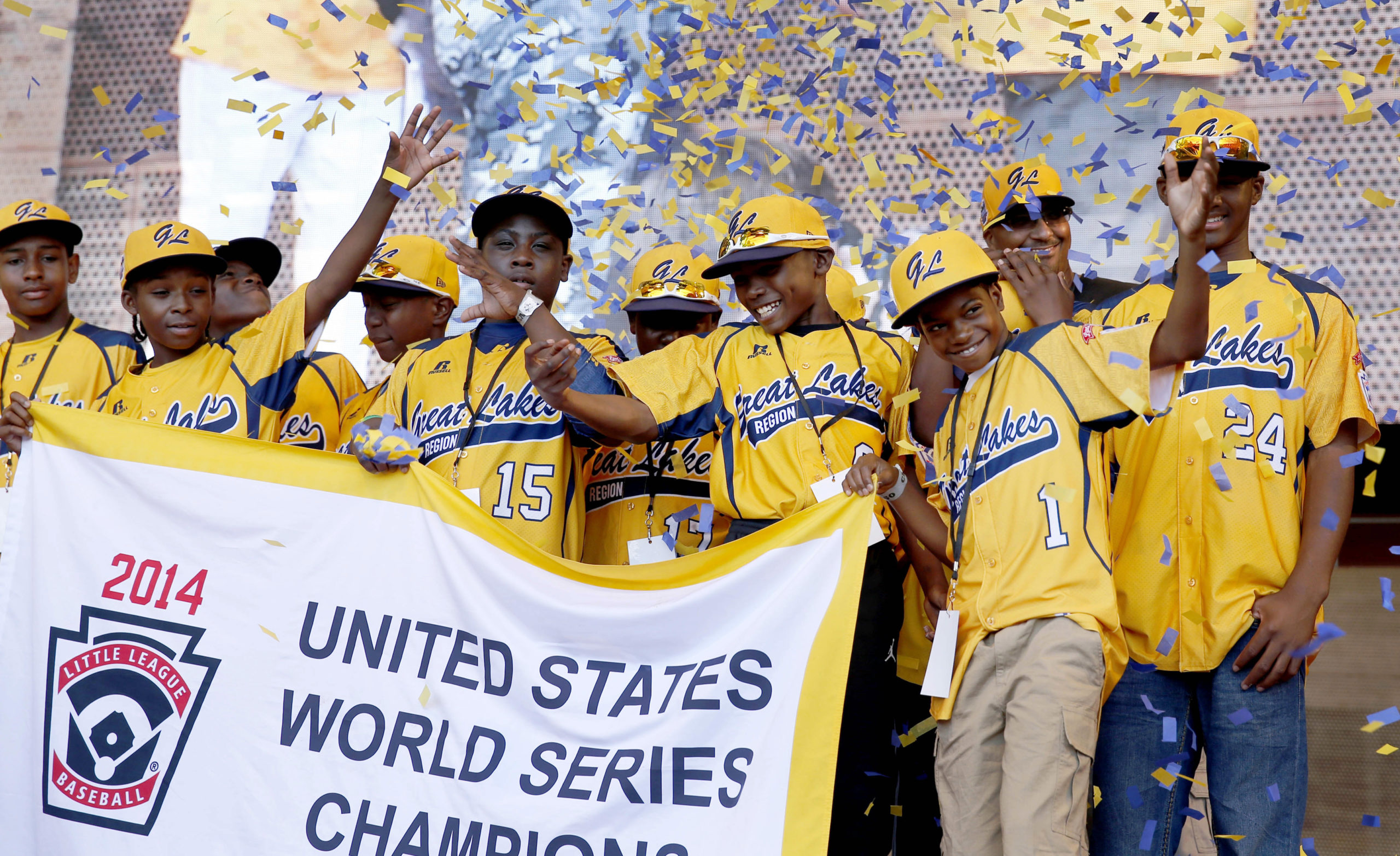 Members of the Jackie Robinson West All Stars Little League baseball team participate in a rally in Chicago celebrating the team's U.S. Little League Championship, Aug. 2014. Joseph Haley founded the little league program in Chicago's South Side