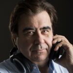 Documentary filmmaker Paul Carvalho with headphones
